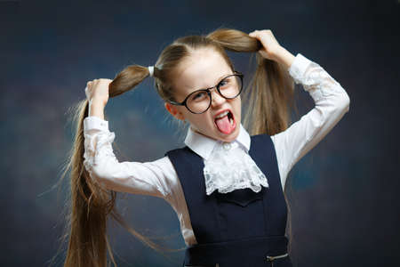 Schoolgirl Wear Uniform Glasses Play Ape Portraitの写真素材