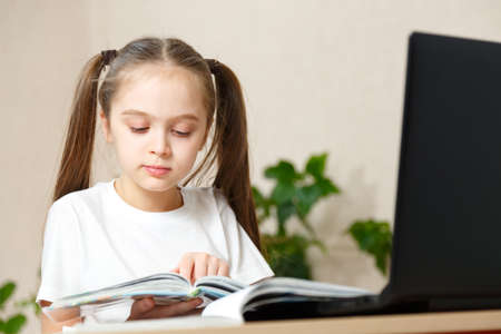 Little Girl Using Digital Laptop E-learning Conceptの写真素材