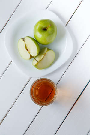 Apple juice and fresh fruits on woodの写真素材