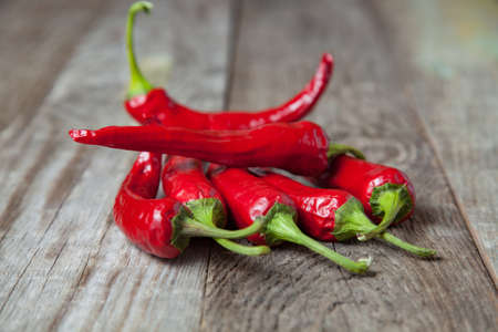 Red hot pepper on a wooden background. Studio photography.の写真素材