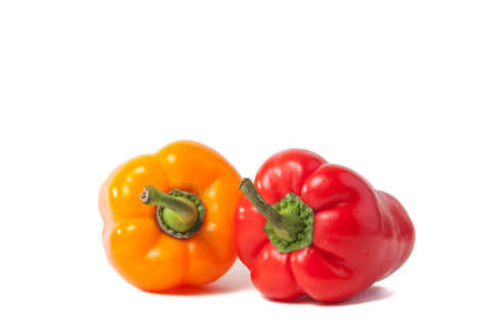 Red and yellow pepper on white backgroundの写真素材