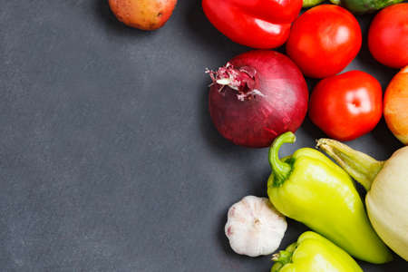 Different raw vegetables on dark background. Healthy eating.の写真素材