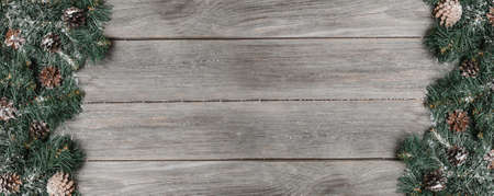 Christmas fir tree on a wooden backgrond. Banner for advertising top view.