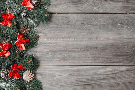 Christmas fir tree on a wooden backgroundの写真素材