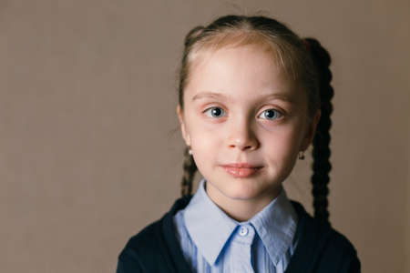 Close up portrait cute school girl in studioの写真素材
