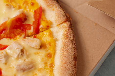 Pizza in a cardboard box against. View from above. Pizza delivery. Pizza menu.の写真素材