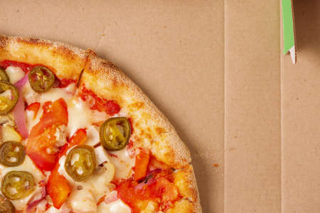 pizza with cheese in a cardboard boxの写真素材