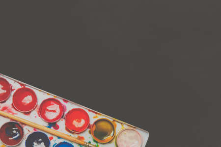 Watercolor paints in a box with copy spase The concept of creativity. Art Supplies. Watercolor...