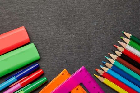 School supplies bottom corner border on a chalkboard backgroundの写真素材