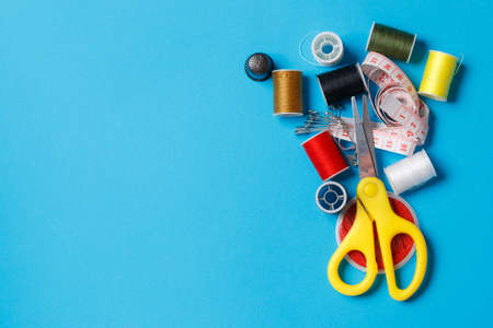 Colorful Thread Spools Tailor Equipment Copy Space. Fibers Set with Pins Craftsman Items Sewing Tools Empty Background. Fashion Designer Accessory Clothes Manufacture Seamstress Supplies Compositionの写真素材