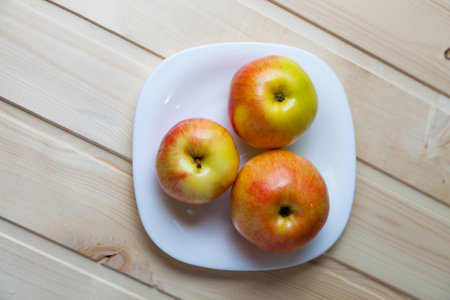 Apples on white plate