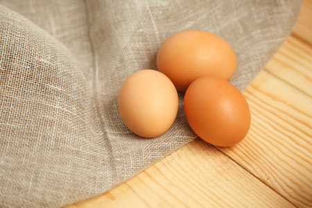 Fresh farm eggs on a wooden rustic background. close upの写真素材