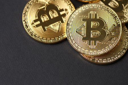 Golden bitcoin with money coins background. Bit coin cryptocurrency banking money transfer business...