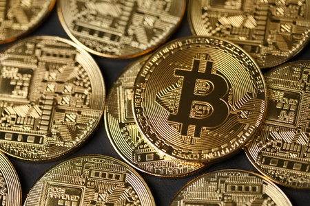 Bitcoins and New Virtual money concept.Stack of Many gold bitcoins on reflective surface.Golden coin with icon letter B. Mining or blockchain technology for cryptocurrency.の写真素材