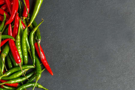 Hot red and green chilli background, top view.の写真素材