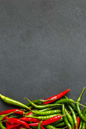 Hot red and green chilli background, top view.の写真素材