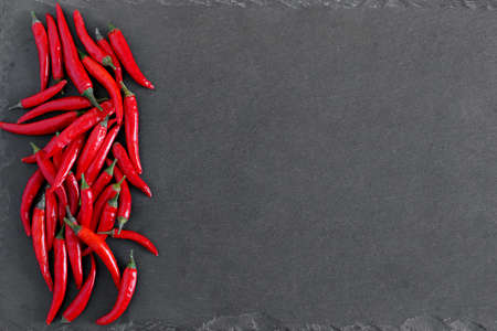 Red peppers on stone background