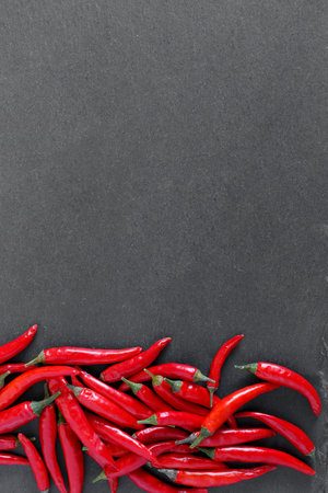 Red peppers on stone backgroundの写真素材