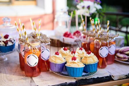 Party and festive table with delicious pastries and drinks.の写真素材