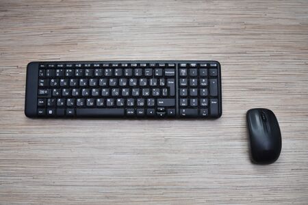 Computer black keyboard and mouse on the table.