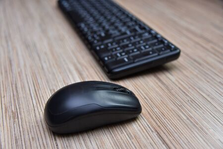 Computer black keyboard and mouse on the table.の写真素材