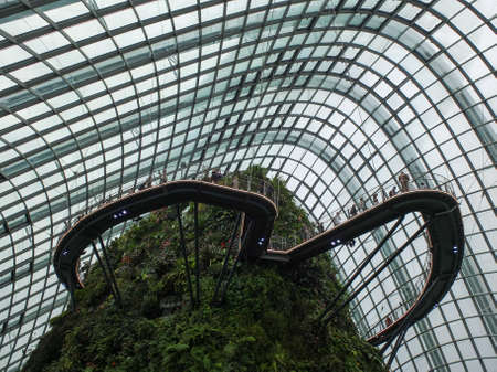 SINGAPORE CITY, SINGAPORE - January 10, 2018: Inside of Cloud Forest dome at Gardens by The bay, a tropical botanic garden, popular travel destination in Singapore.のeditorial素材
