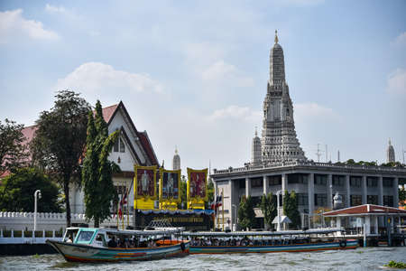 Bangkok, Thailand - 12 January 2019: Boat with tourists departs from the pier Wat Arun.のeditorial素材