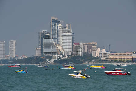 Pattaya, Thailand - 19 January 2019 - sea view from Pattaya beach with many boats and skyscrapers in the background. tourist season.のeditorial素材