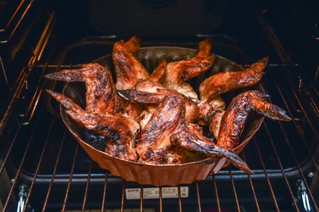 baked chicken wings in the oven at home during quarantine isolation.の写真素材