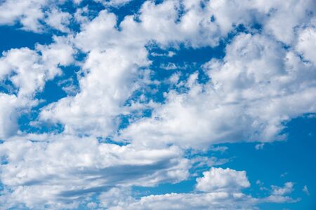 White heap clouds in the blue sky. Cloudscape over horizon. Heaven.の写真素材