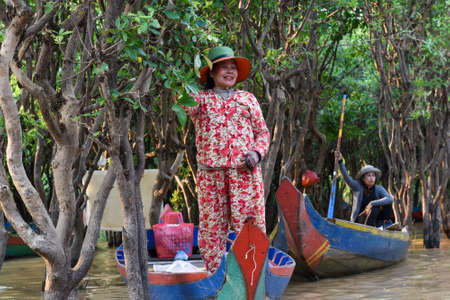 Siem Reap, Cambodia - 17 01 2019 - Service boat waiting for the customers at Tonle sap, the floating village.のeditorial素材