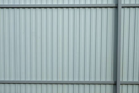 Gray corrugated metal fence. Part of the fence.の写真素材