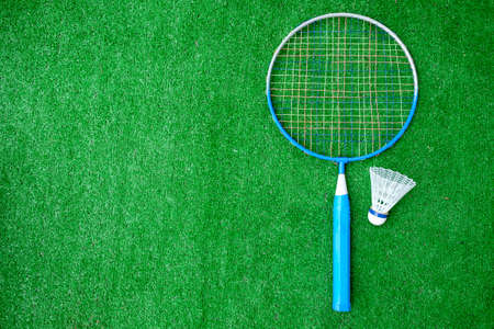 Two badminton mini rackets with white shuttlecock on the green background, active games. copy space.の写真素材