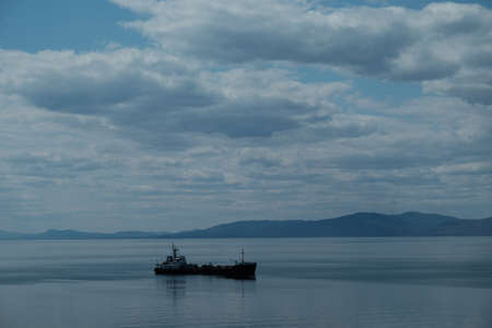 Empty container cargo ship in the blue sea. Aerial view.