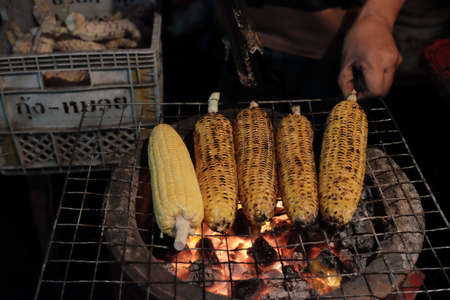 grilled corn in a street food market.の写真素材