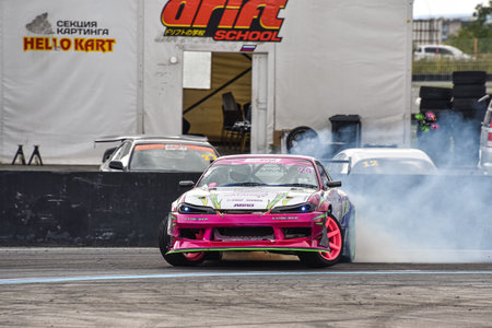 VLADIVOSTOK, RUSSIA - OCTOBER 02: Car drift, Sports car wheel drifts and a lot of smoke on the track. Russian drift show RDS without borders on October 02, 2021.のeditorial素材