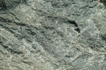 Gray stone mountain texture. Abstract rocks background. The texture of the stone wall close-up.の写真素材