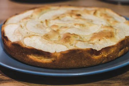 Close-up Apple Pie on a gray plate on a Brown Rustic Wooden Background.の写真素材