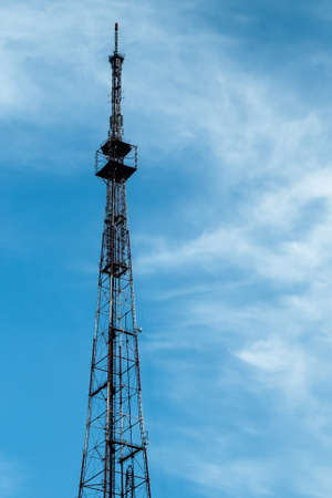 Telecommunications tower. Mobile phone and TV base station in a small town.の写真素材