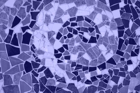 ceramic mosaic floor or wall. photo toned in the color of the year very peri. mosaic top view....