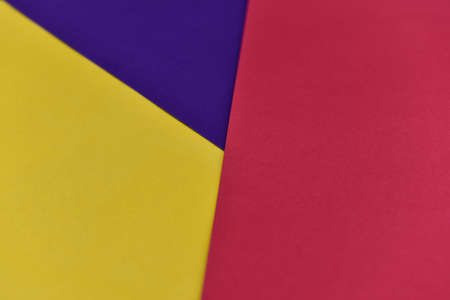 abstract geometric paper background. violet, yellow and red trendy colors. The backdrop for an...