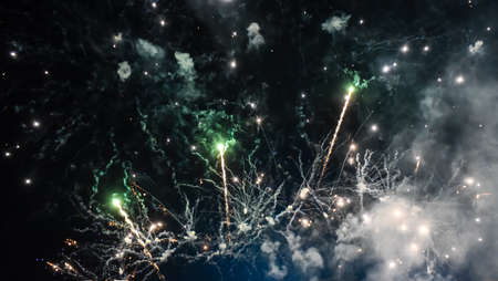 Festive beautiful fireworks at night over the city.の写真素材