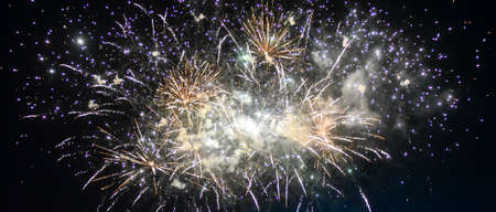 Festive beautiful fireworks at night over the city.の写真素材