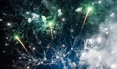 Festive beautiful fireworks at night over the city.の写真素材