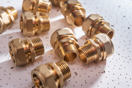 Plumbing fittings for water pipe on white textured background.の写真素材