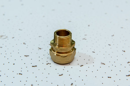 Plumbing fittings for water pipe on white textured background.の写真素材