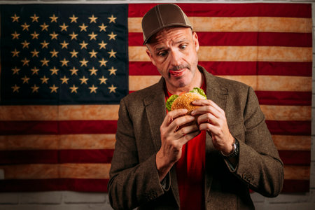 American man eating a hamburger.の写真素材