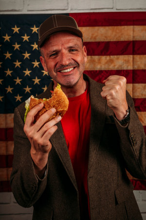 American man eating a hamburger.の写真素材
