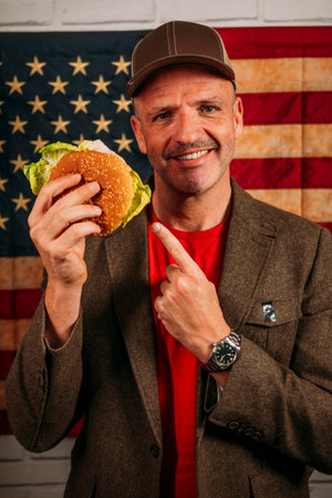 American man eating a hamburger.の写真素材