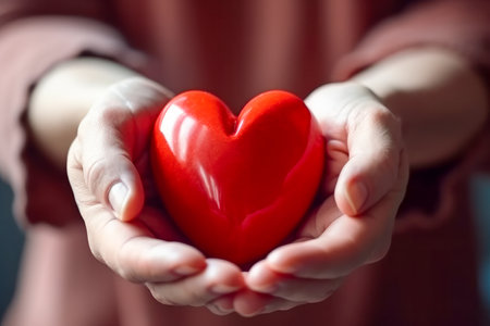 Close-up of Hands Holding Red Heart. Love and Support for World Blood Donor Day - Give Blood, Save Lives - Generative AIの素材